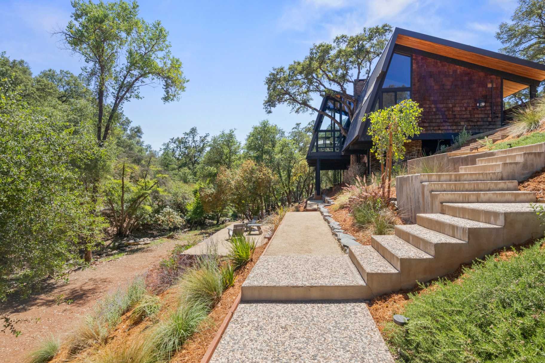Granite-paver walkway and steps leading up to the home